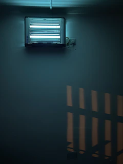 Lumiguard expert setting bait stations in a bright commercial kitchen to prevent rodents