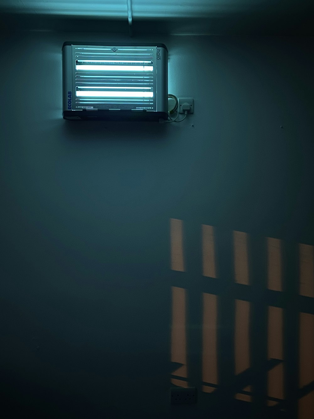 minimalist photography of blue LED emergency lamp