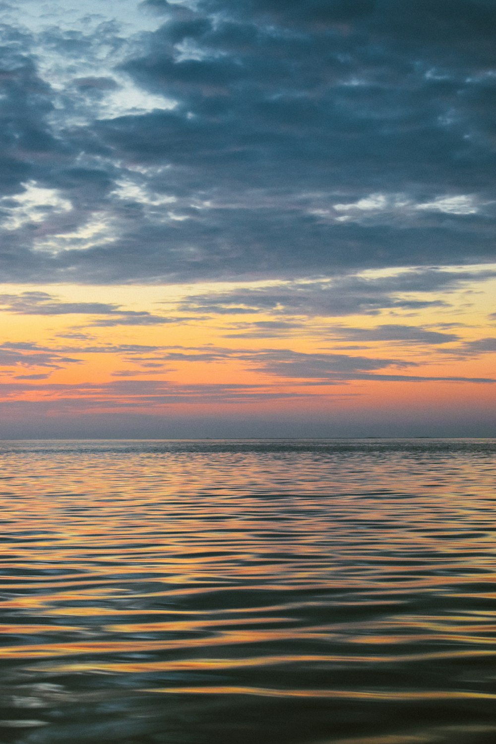 timelapse photography of rippling sea water during golden hour