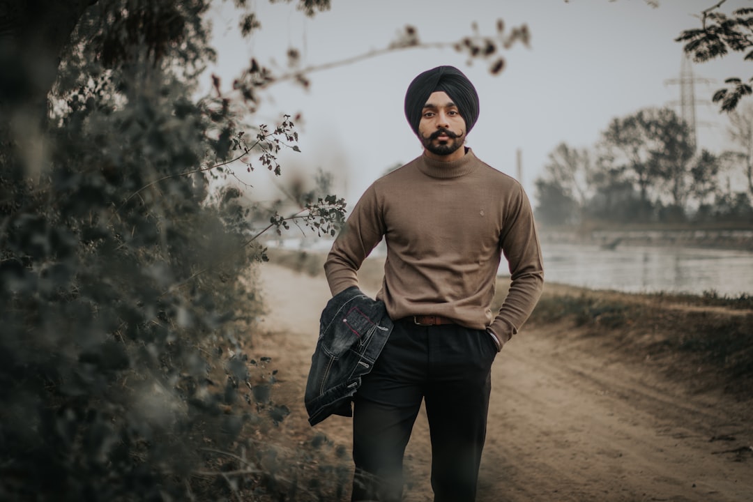 man standing near trees