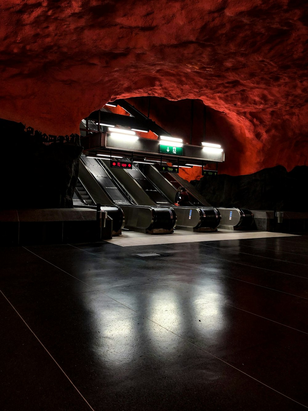 gray escalator inside building