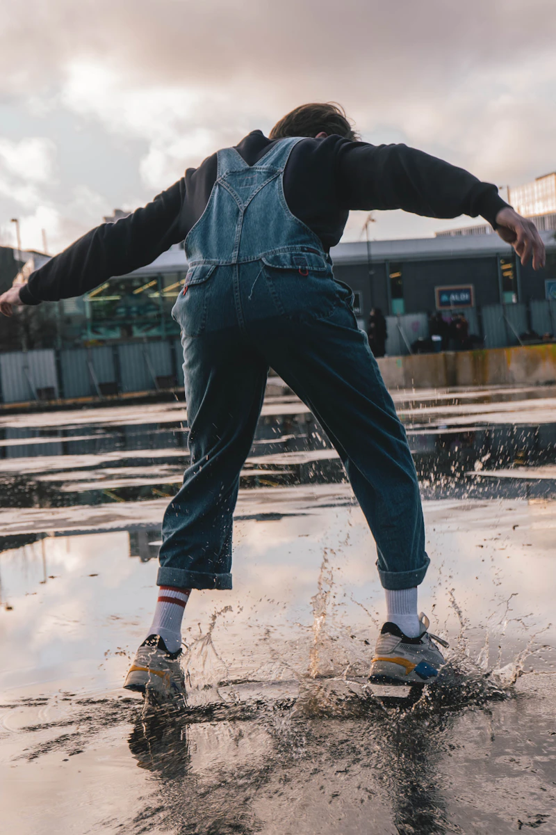 A man in denim overalls