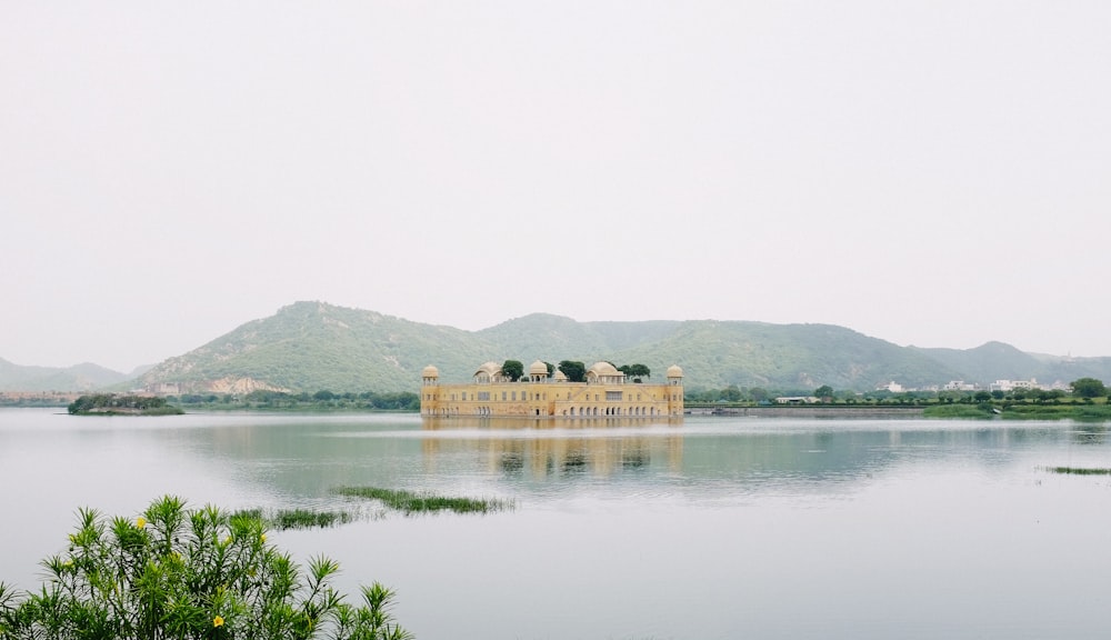 building in body of water near trees during day