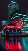 A futuristic city skyline illuminated at night.