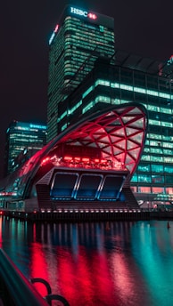 A futuristic city skyline illuminated at night, showcasing advanced technology and digital elements.