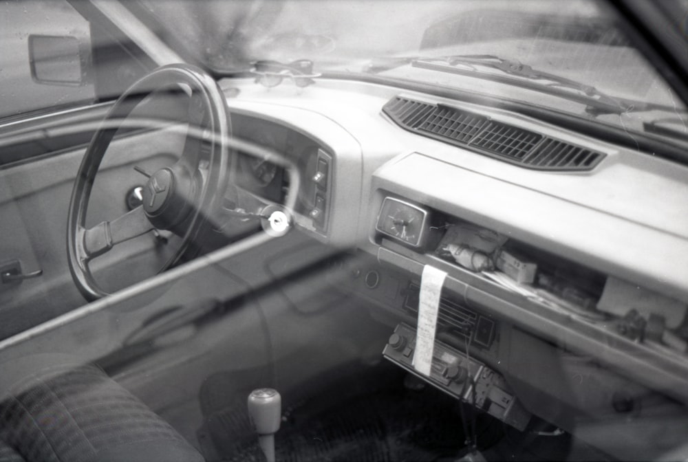 grayscale photo of vehicle interior