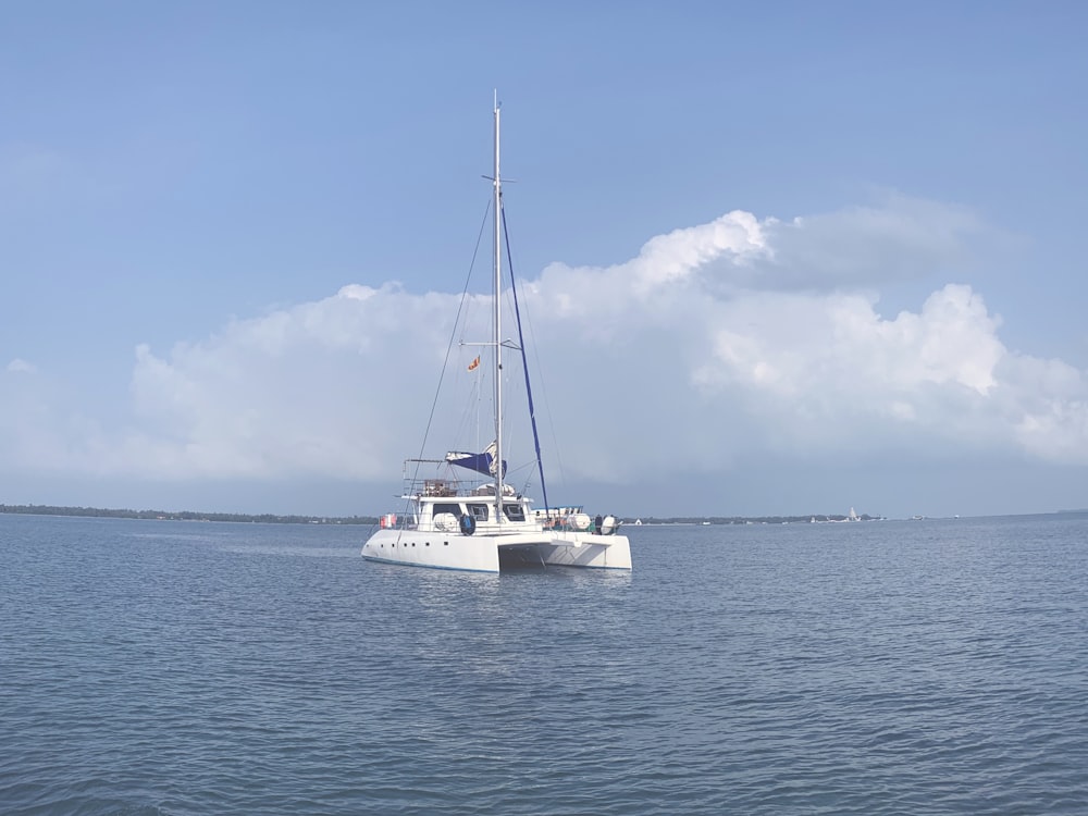 white speedboat on the body of water