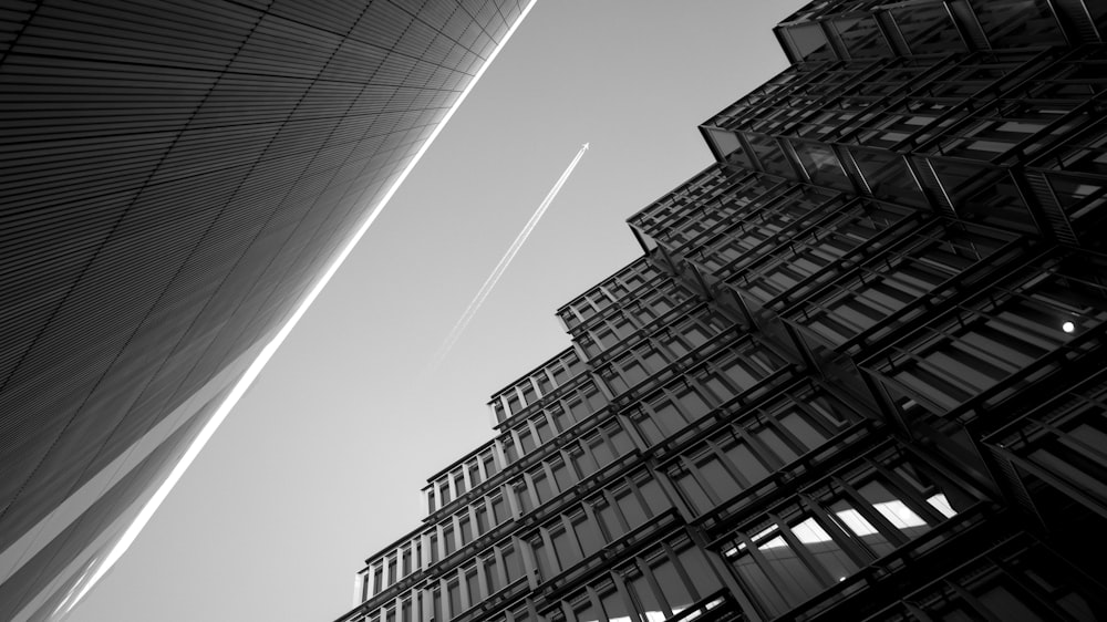 contrails above buildings during day