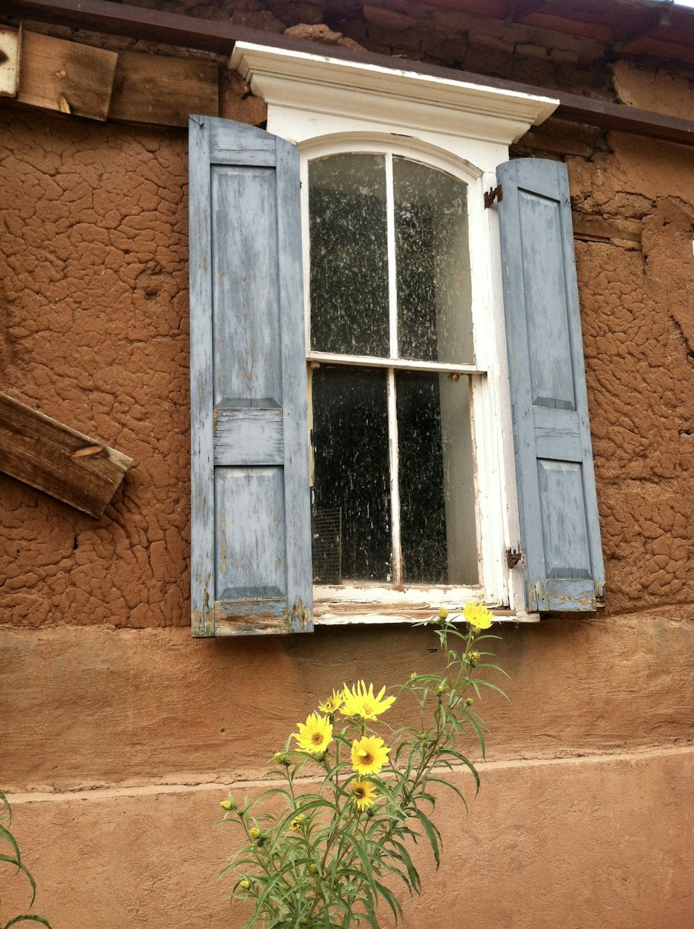 white and grey wooden glass window