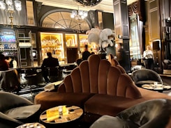 Luxurious hospitality lounge with plush seating and attentive service