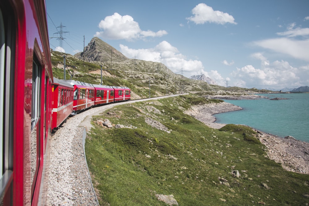 red train near lake