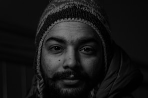 grayscale photography of man wearing knitted beanie
