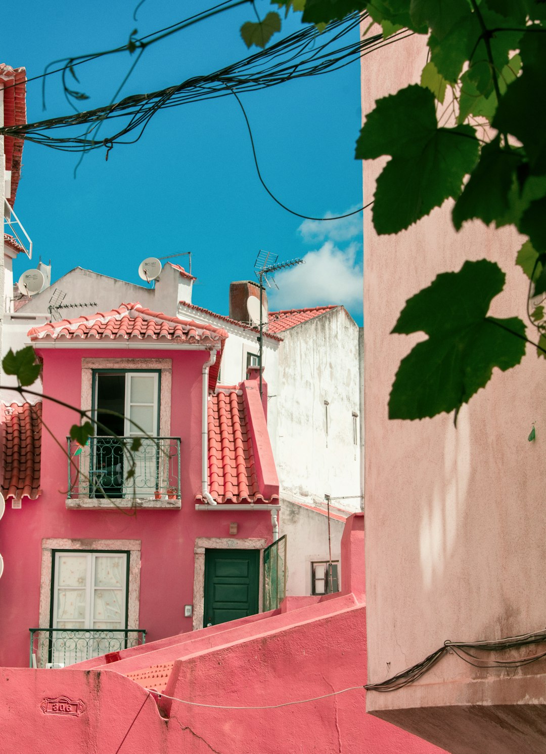 pink and white concrete house during daytime