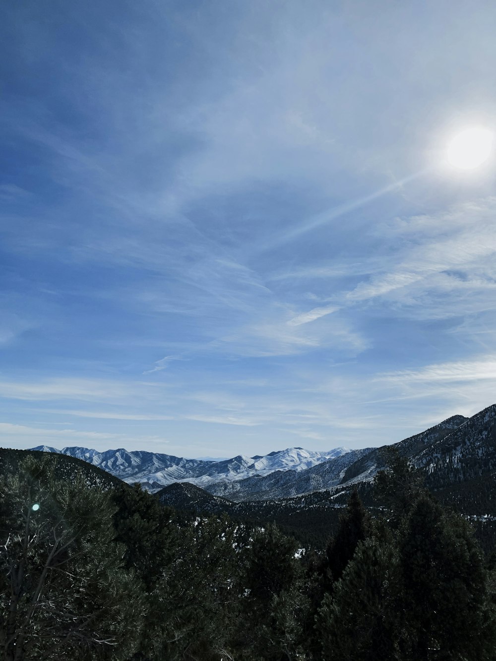 aerial photography of mountain under blue and white sky