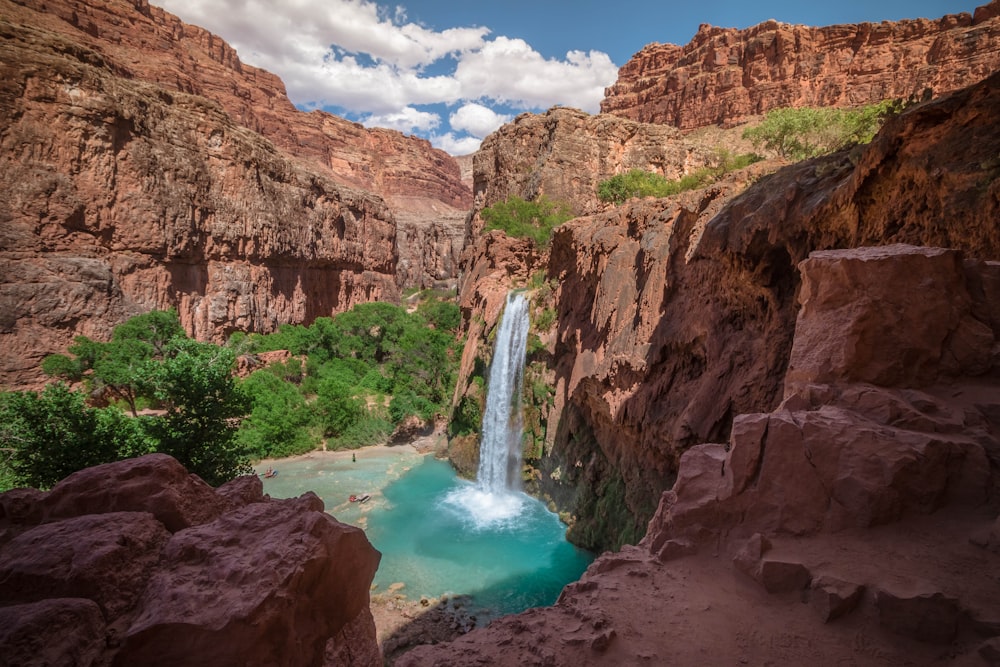 Havasupai Falls in Arizona under white and blue sky