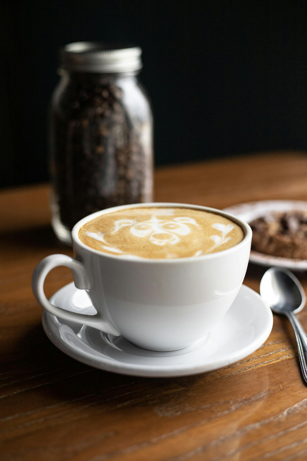 coffee in white cup on white saucer