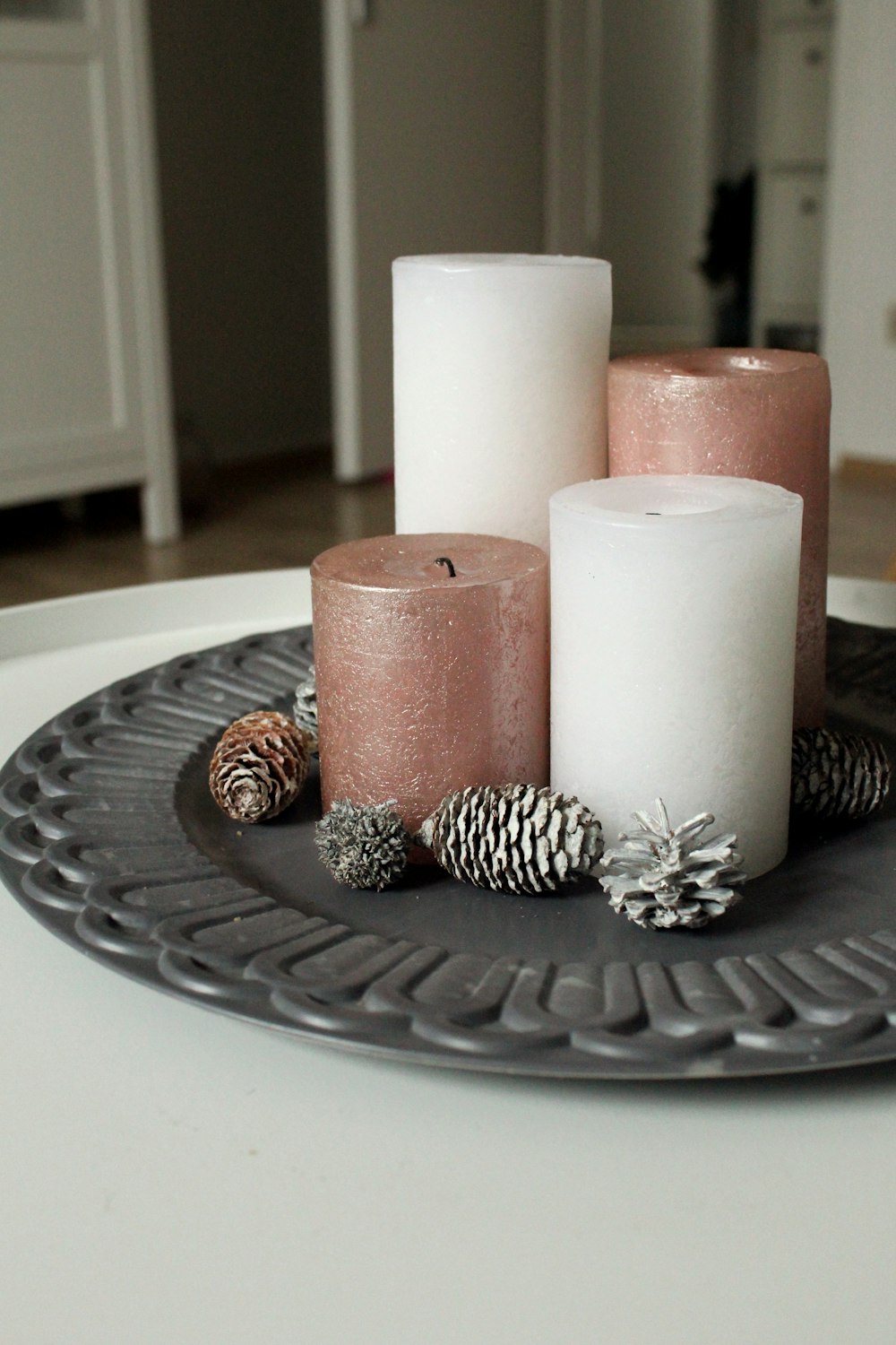 white and brown pillar candles