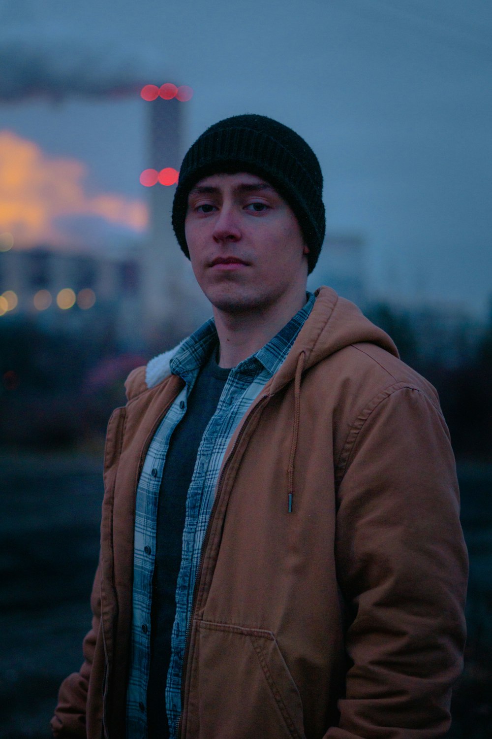 man in brown jacket and black beanie