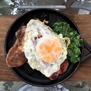 A cozy single-serving skillet meal with sautéed vegetables and a perfectly cooked egg.