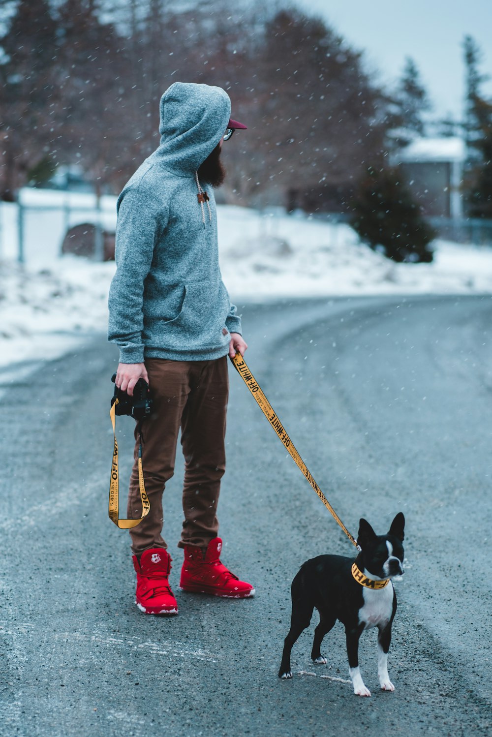 man holding dog leash