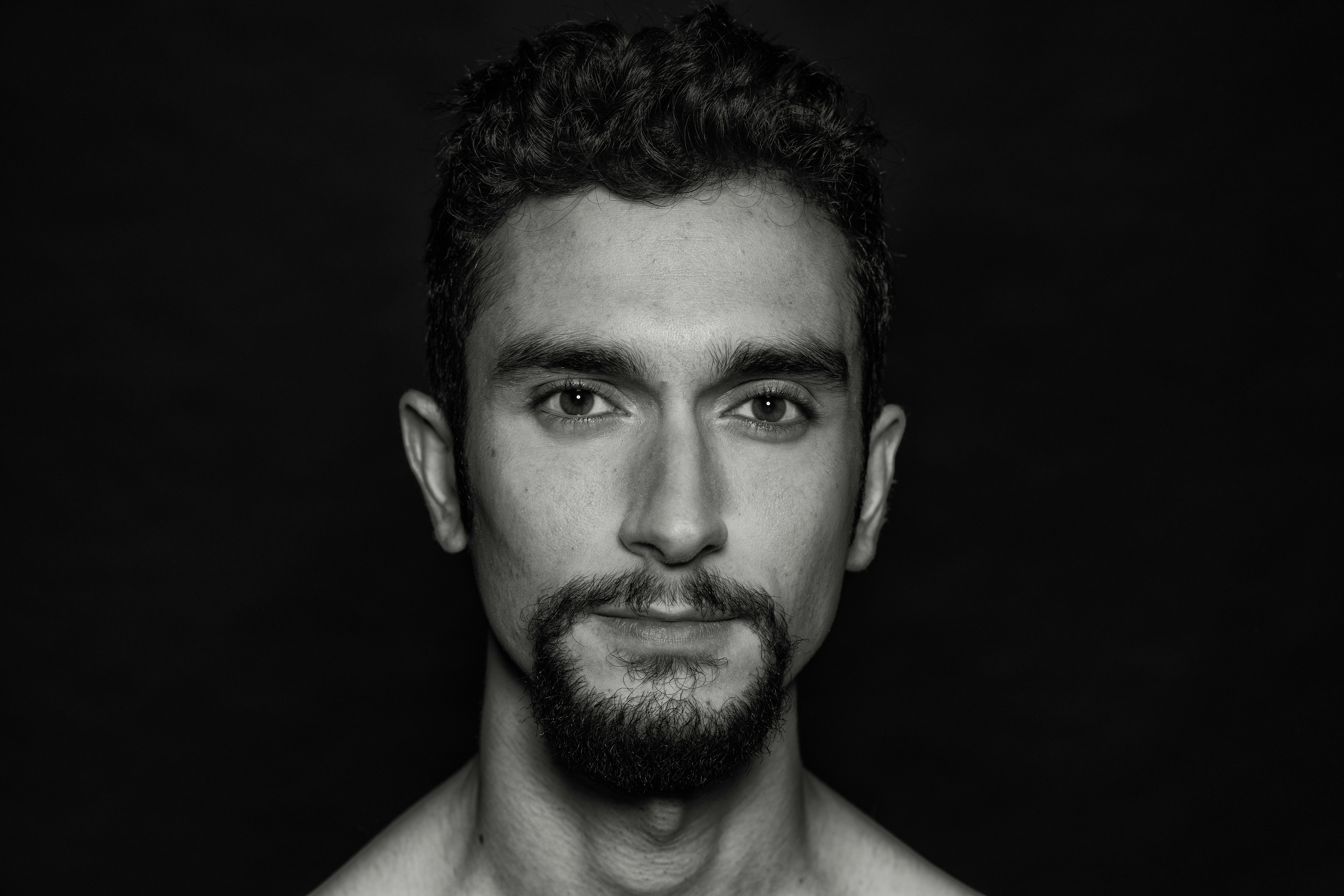 grayscale photography of man's faceby christian buehner