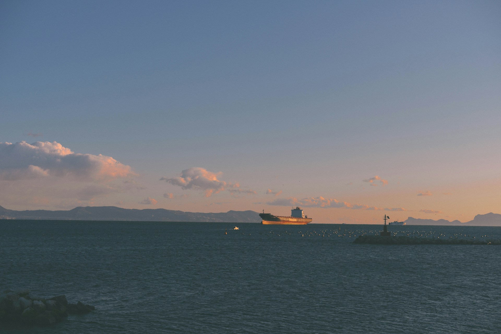 woman wearing yellow long-sleeved dress under white clouds and blue sky during daytime