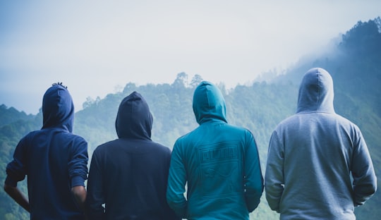 four person wearing pullover hoodies in Kodaikanal India