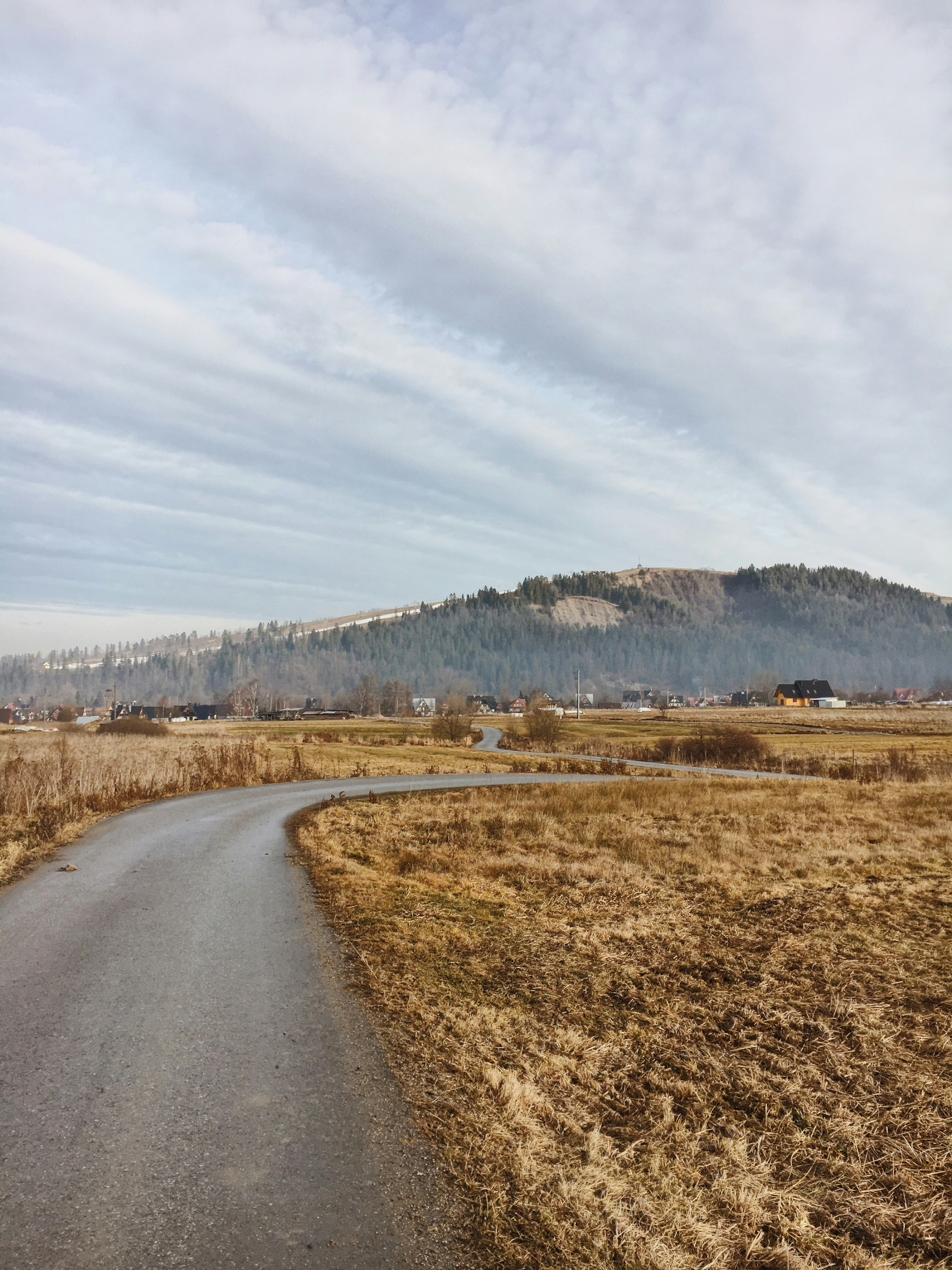green mountain under white clouds during daytime