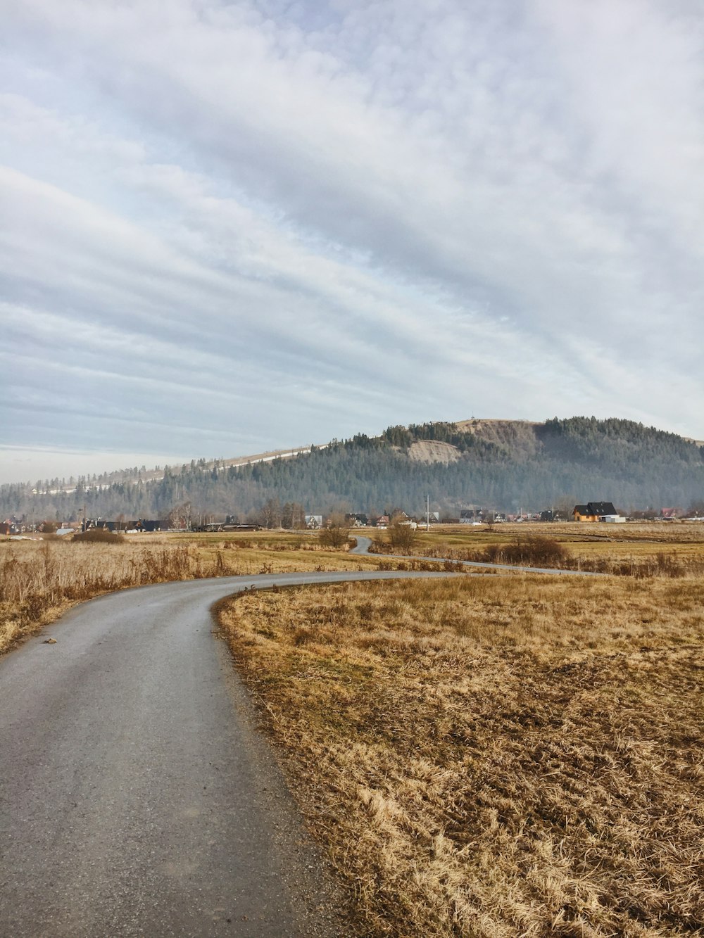 green mountain under white clouds during daytime