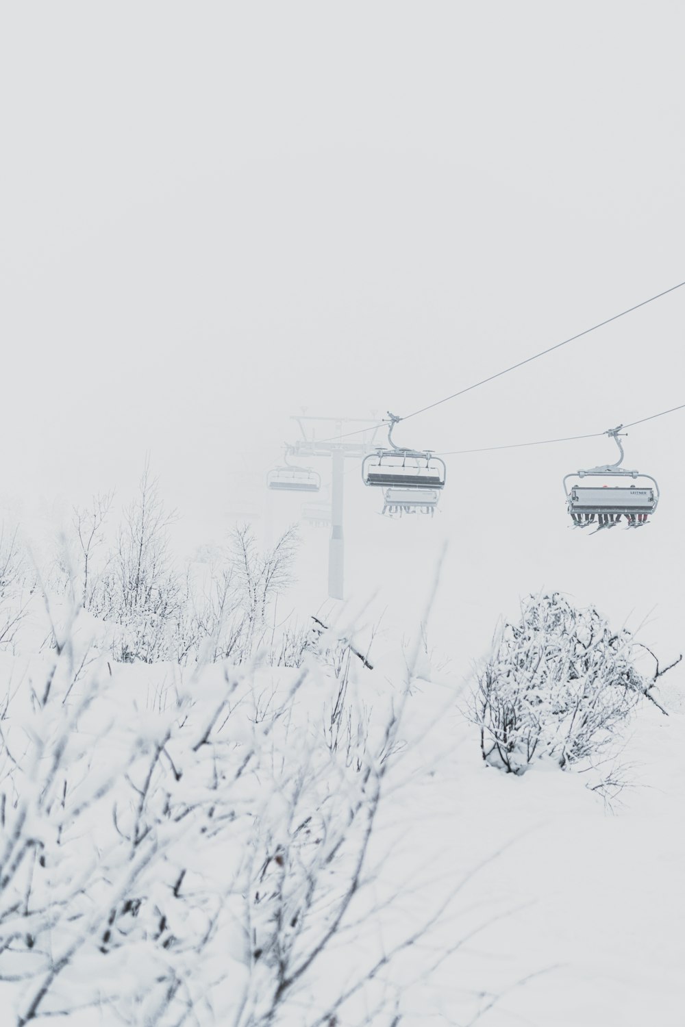 cable car covered with snow during daytime