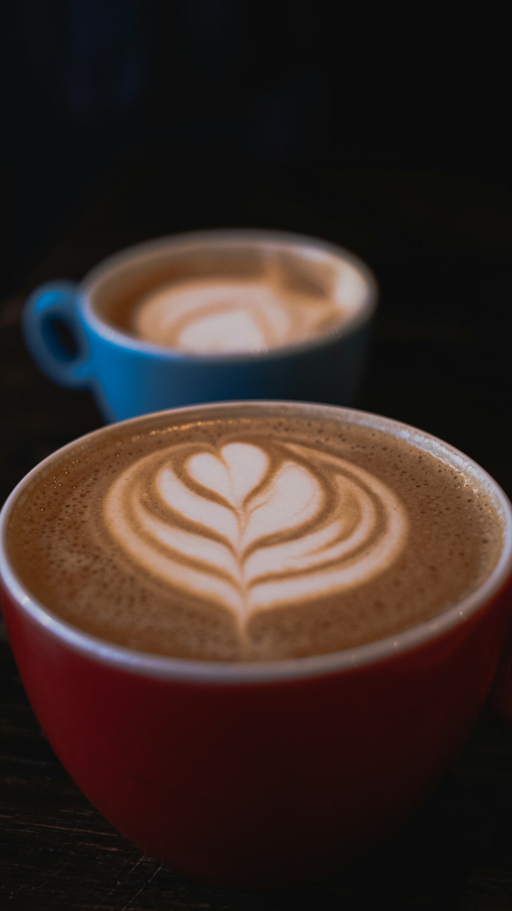 red and blue ceramic mugs