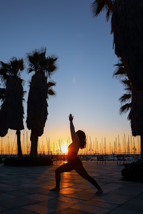 woman standing while dancing on pathway