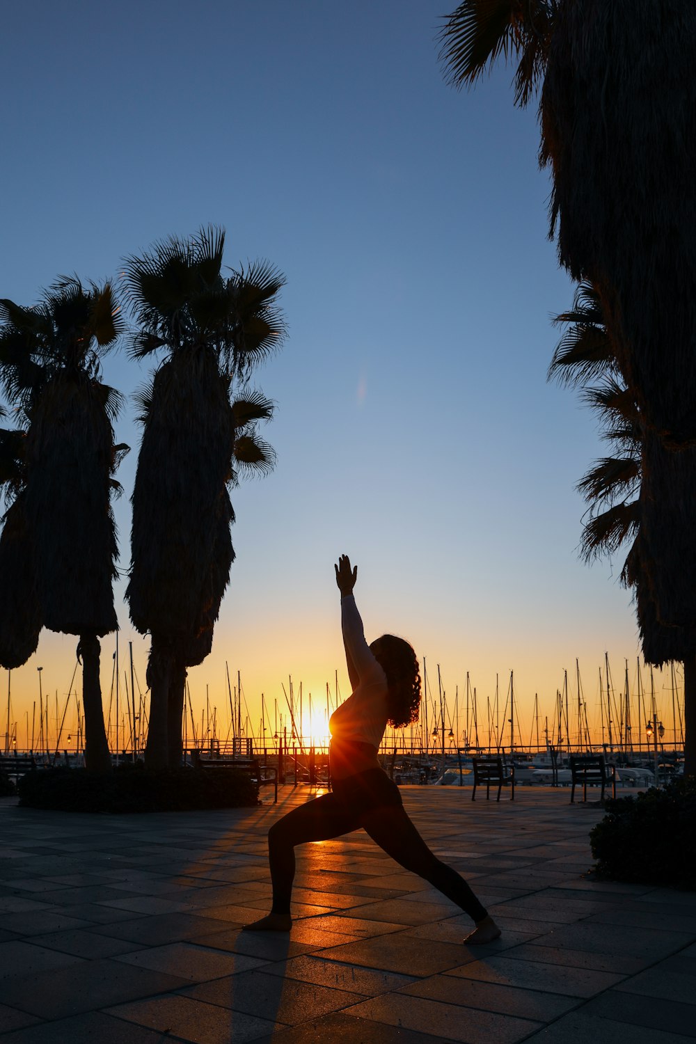 woman standing while dancing on pathway