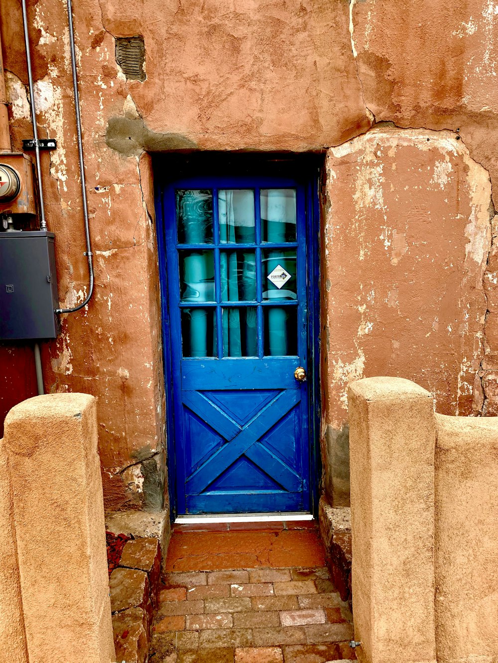 closed blue wood-framed glass door