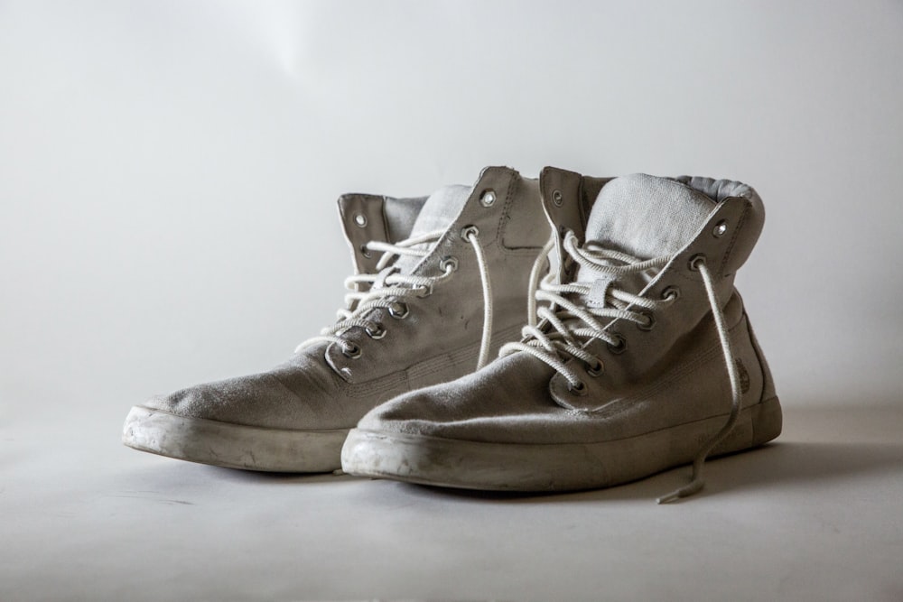 white lace-up high-top shoes