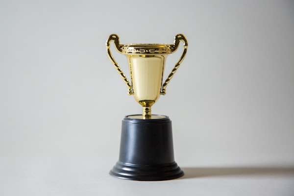 A simple trophy on a stark white background