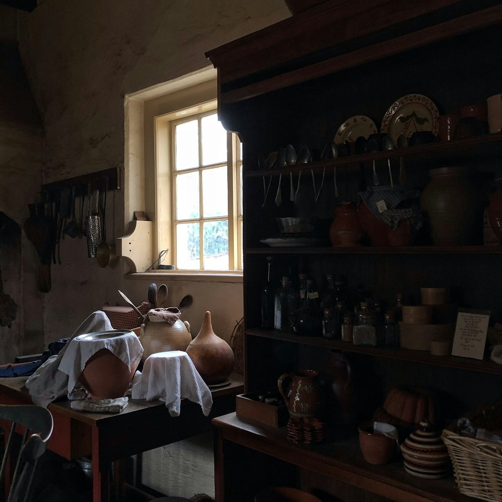 brown wooden cabinet with sheelves