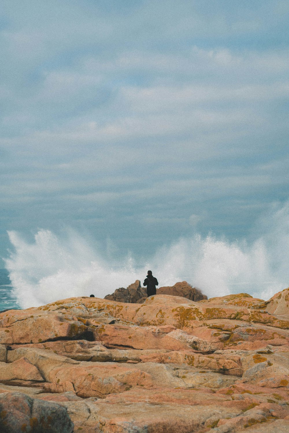 person standing near body of water