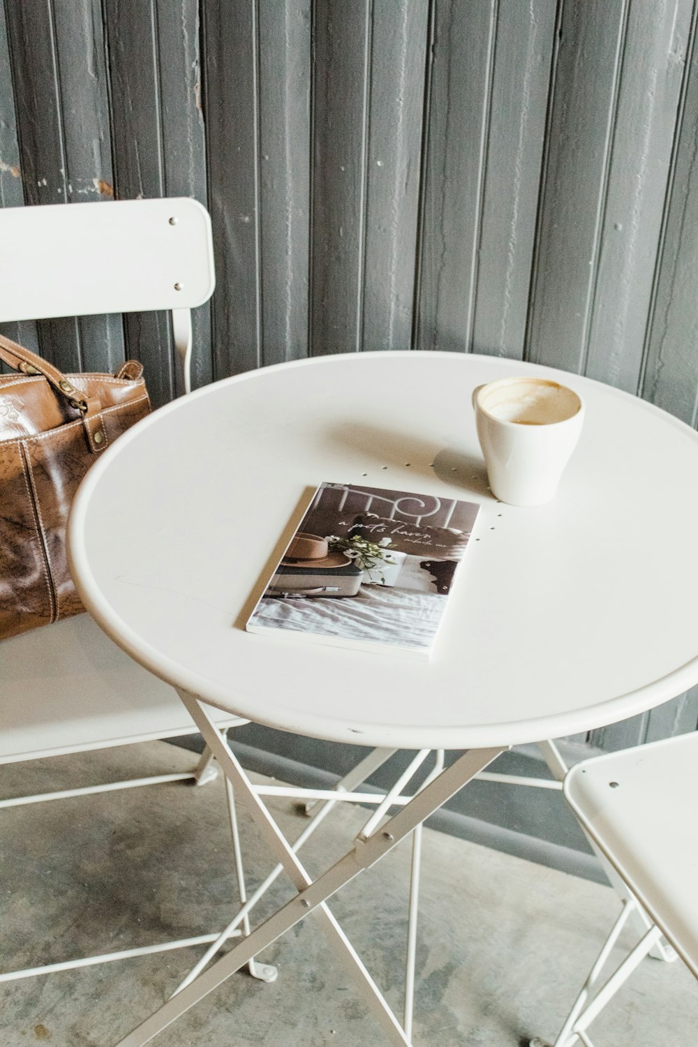 white cup on white table