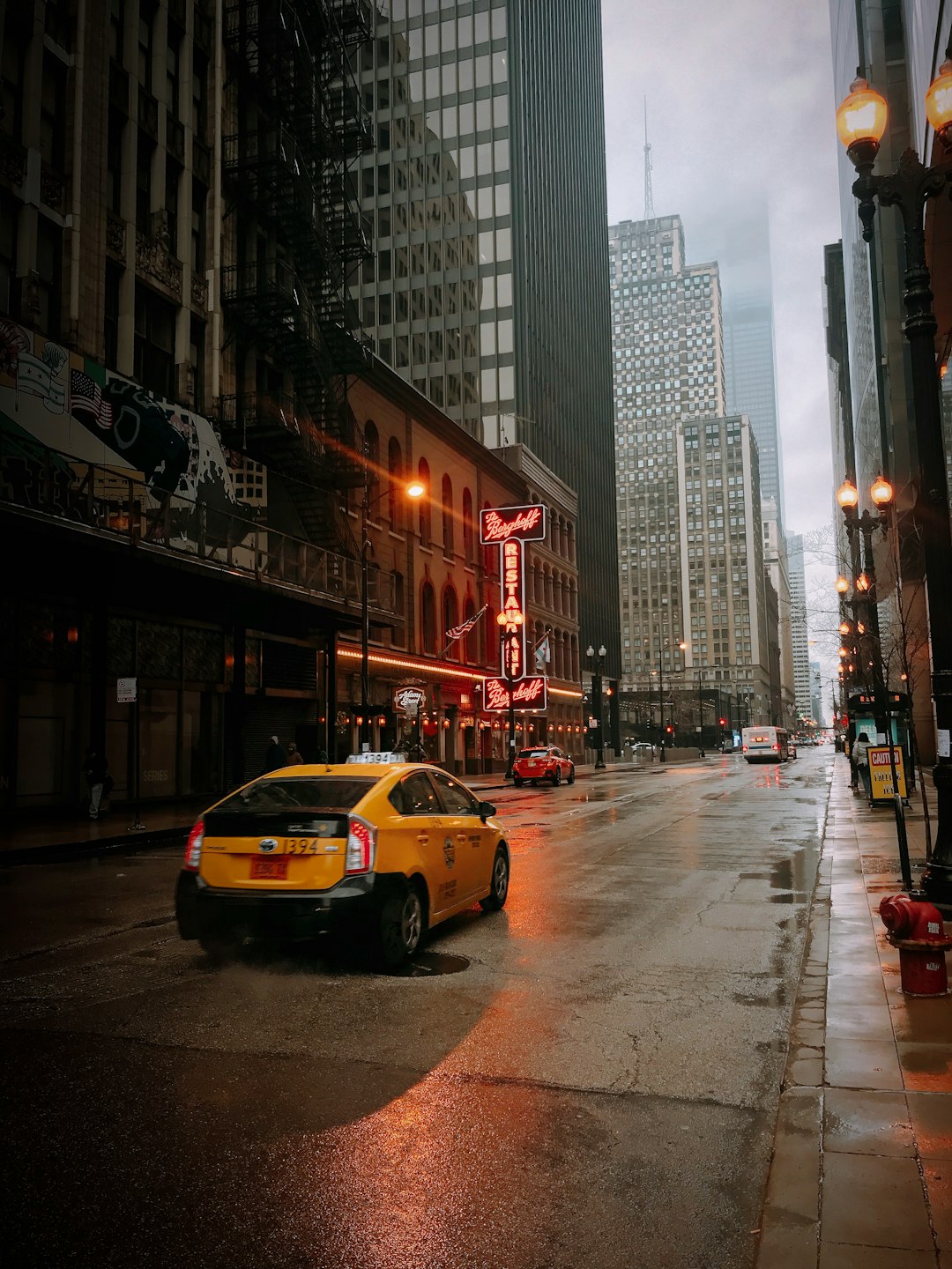 yellow sedan on road