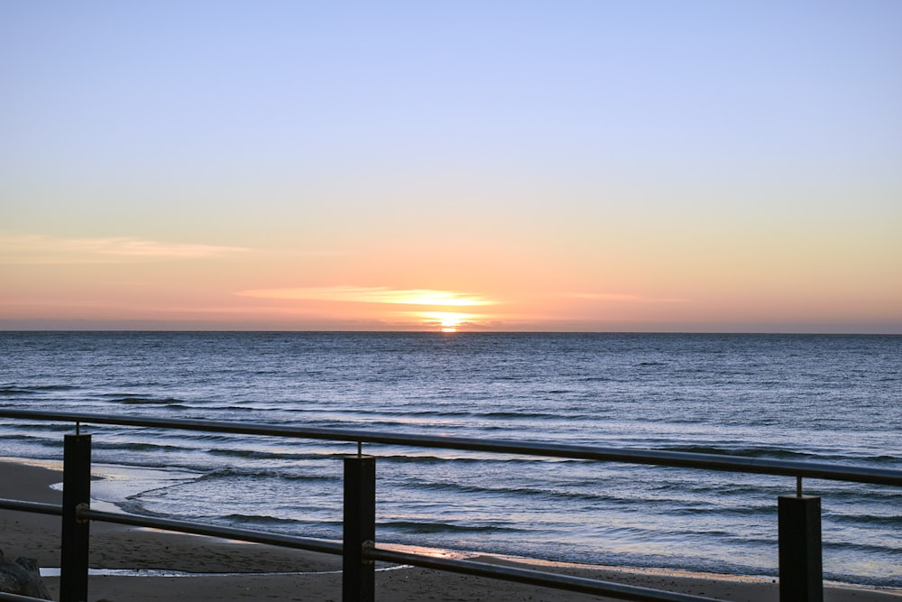 calm body of water during horizon