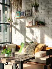 Cozy farmhouse white dining bench set against a rustic wooden table with soft natural light.