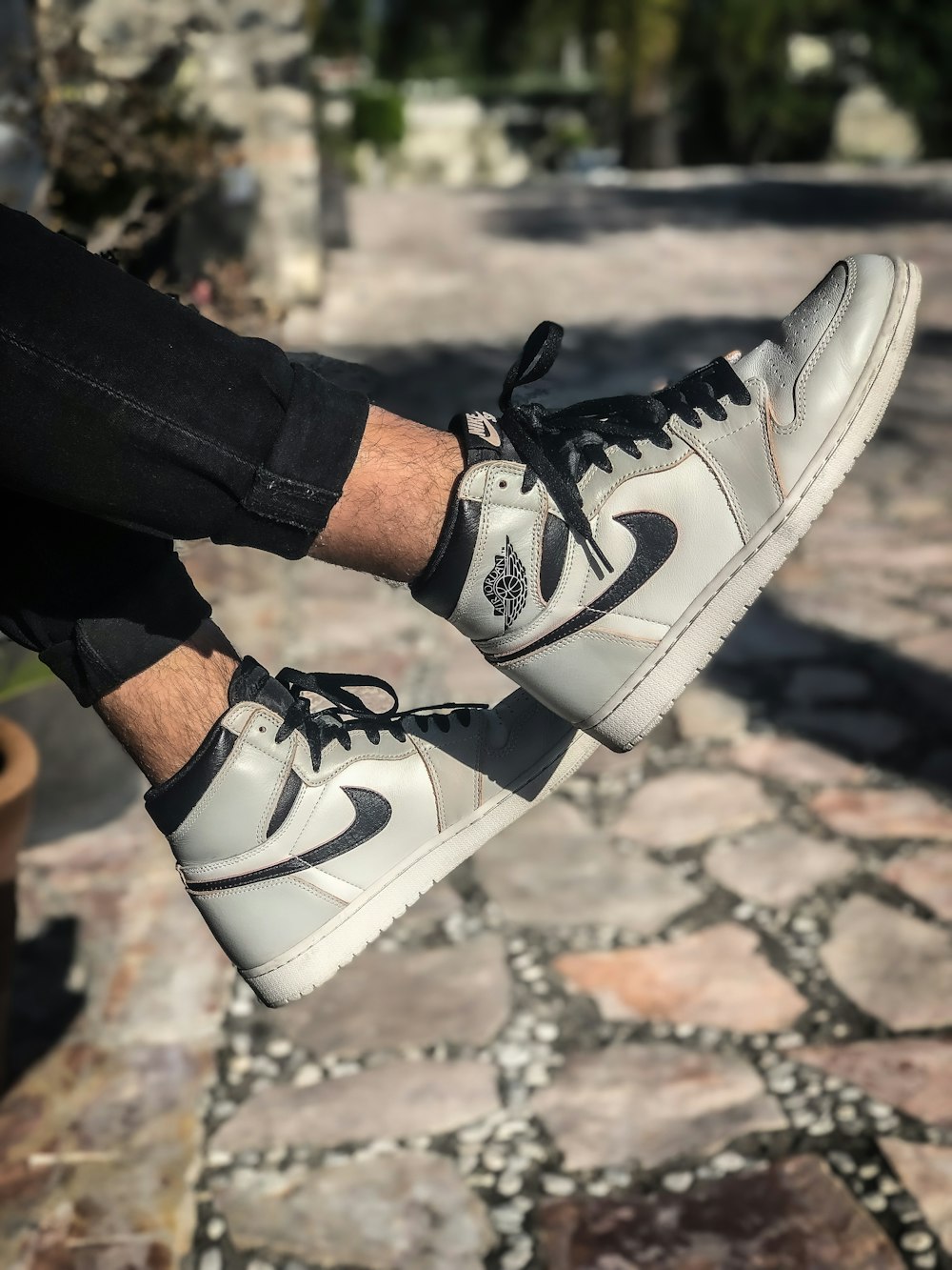 pair of white-and-black Air Jordan basketball shoes