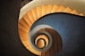 high-angle photo of brown wooden spiral staircase