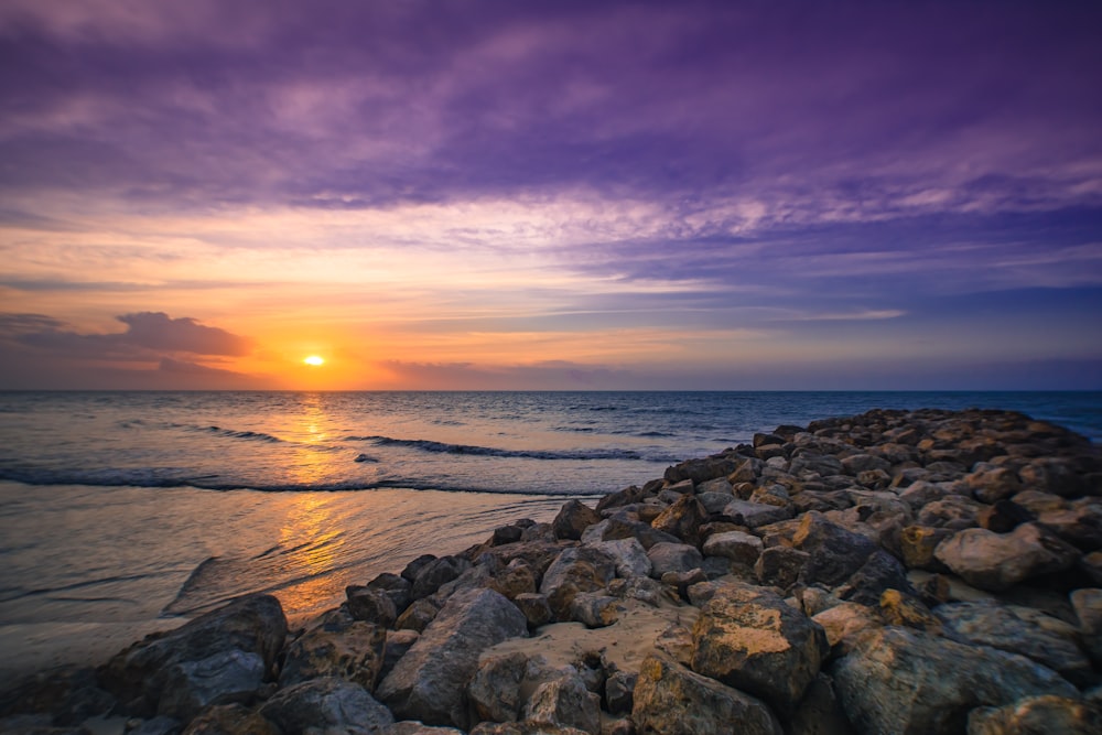 rocks and calm sea during golden hour