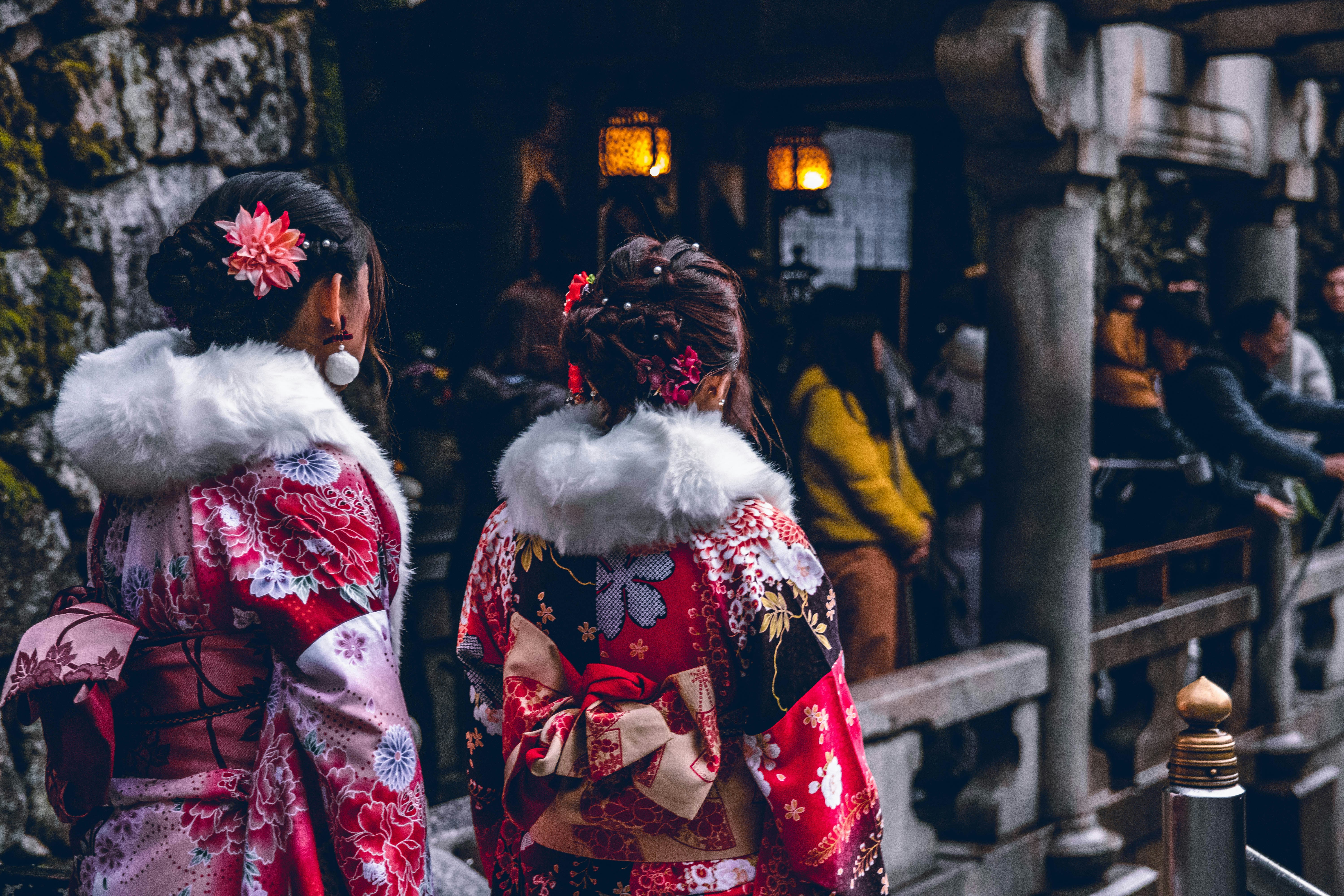 two women in red and white floral kimono dresses