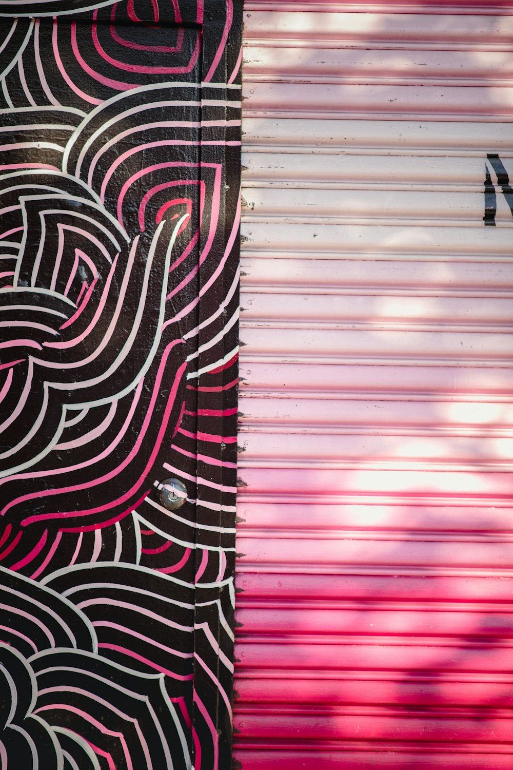 pink and black wooden door