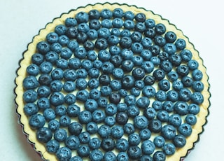 blueberry cheesecake on white surface