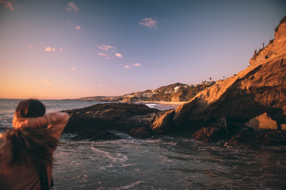 man standing near body of water