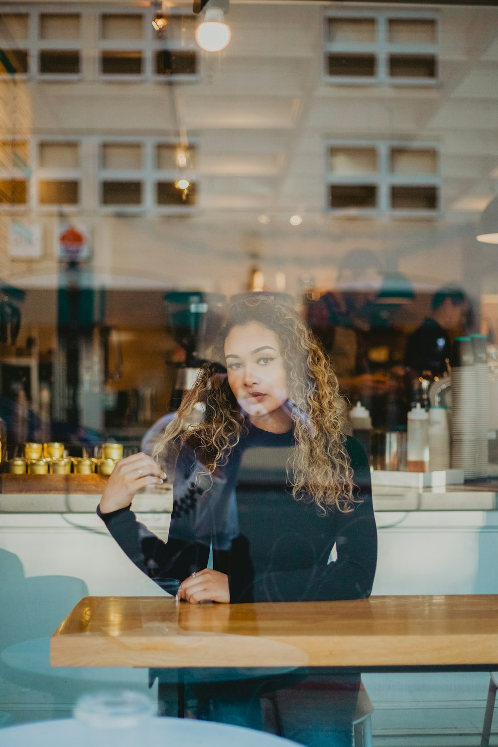 woman sitting beside table